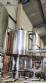 Llenadora rotativa gravimtrica de acero inoxidable con cabina