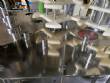 Llenadora rotativa gravimtrica de acero inoxidable con cabina