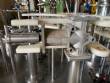 Llenadora rotativa gravimtrica de acero inoxidable con cabina