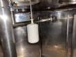 Llenadora rotativa gravim�trica de acero inoxidable con cabina