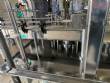 Llenadora rotativa gravim�trica de acero inoxidable con cabina
